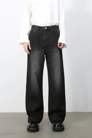 Faded dark wide-leg denim jeans with a casual, chic look.