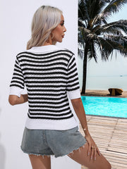 Black and white striped knit polo top with short sleeves and a collar.