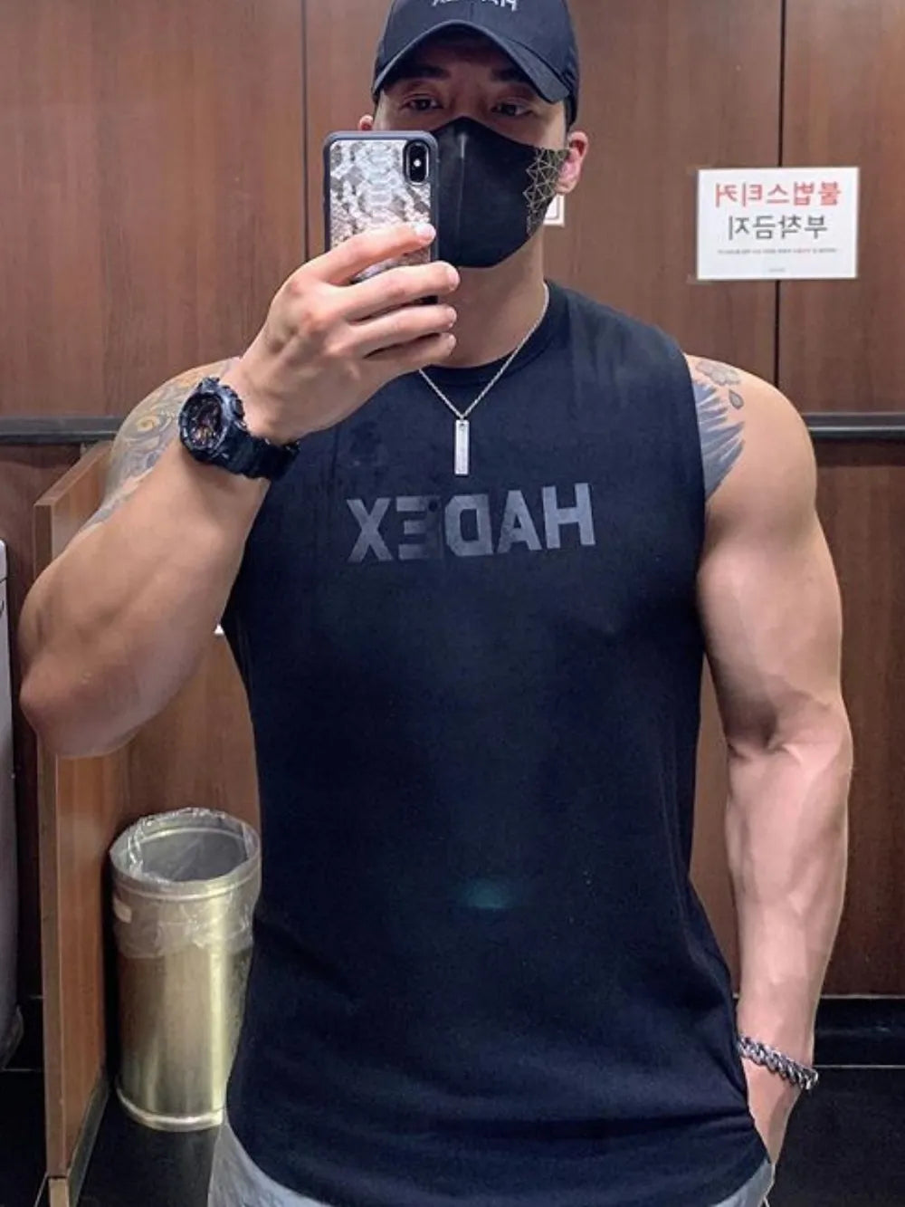 Black Vonili reversed logo muscle tank top with crew neck.