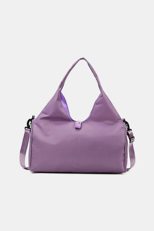 Streamlined sporty duffel bag in Red-Violet with adjustable strap and top handles.