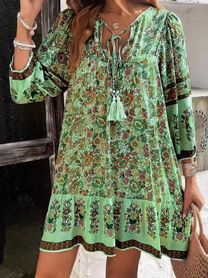 Matcha green floral print mini dress with tassel tie neckline and tiered hem