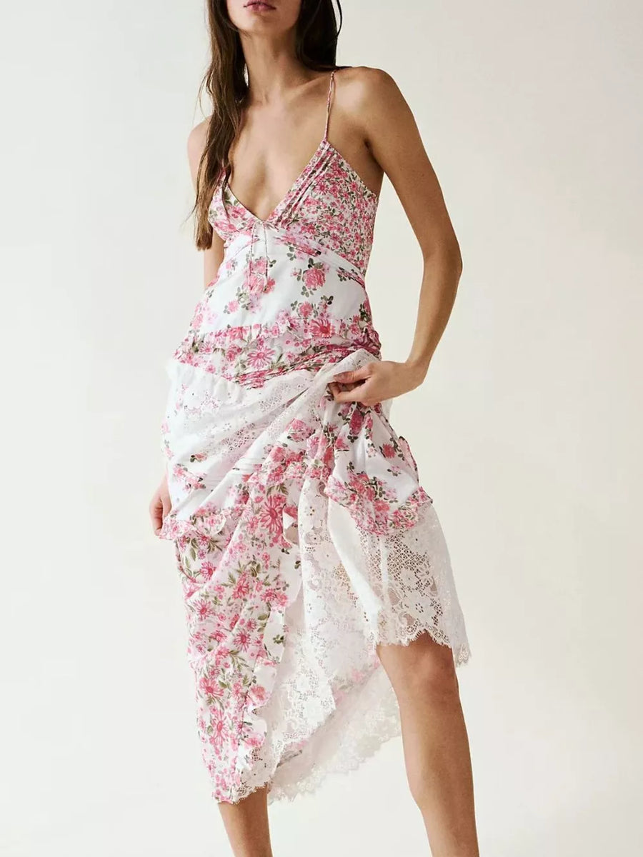 Floral lace maxi dress in pink floral print with ruffled tiers and lace trim.