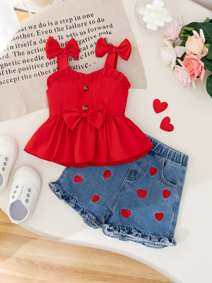 Red bowknot top with heart embroidered denim shorts set for baby girls.