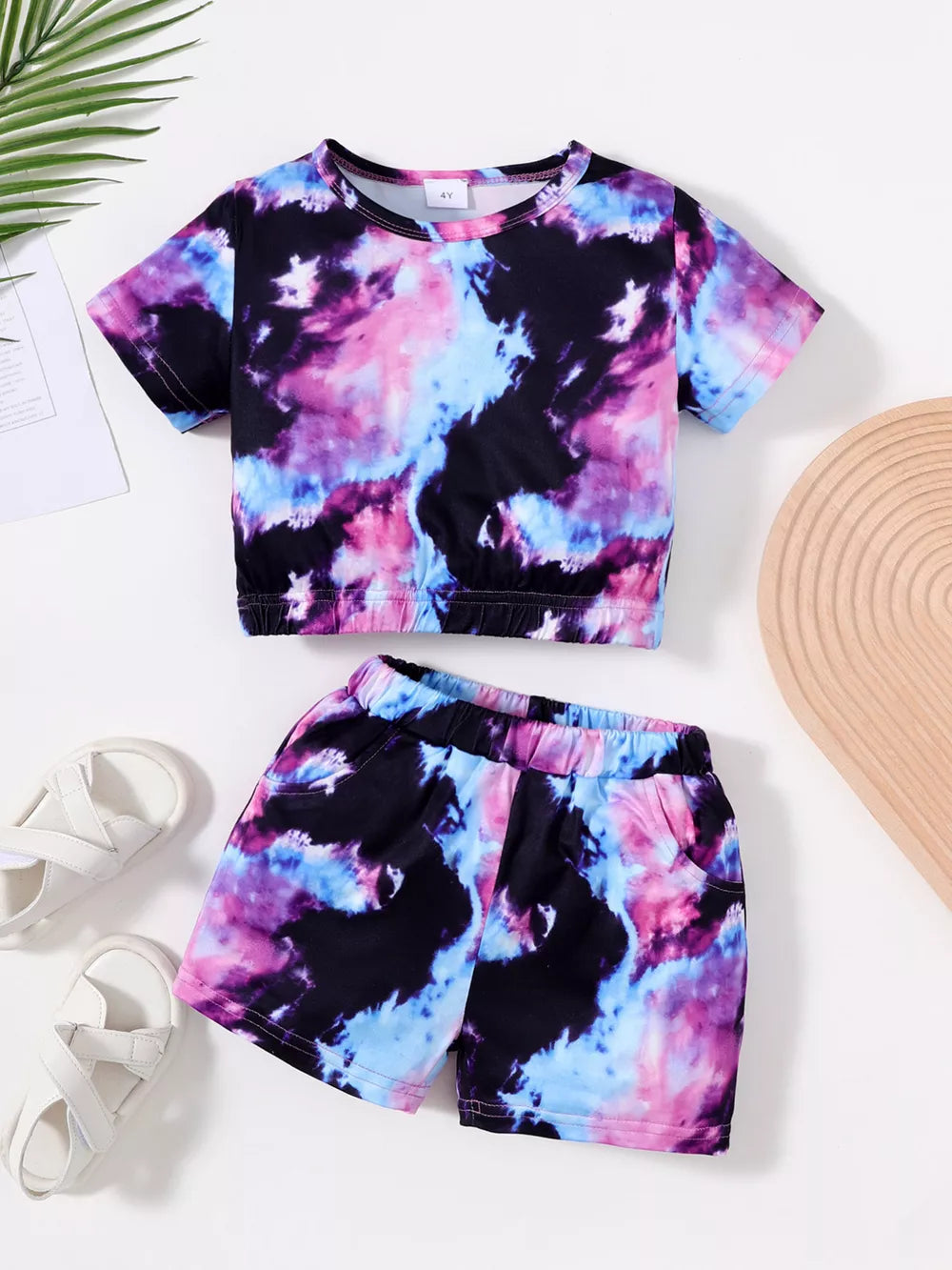 Toddler girls' tie-dye two-piece set with a short-sleeve top and elastic-waist shorts.