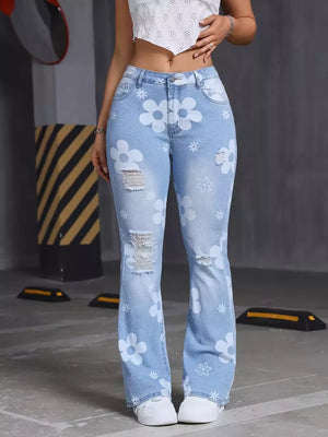 white flare jeans featuring distressed and floral