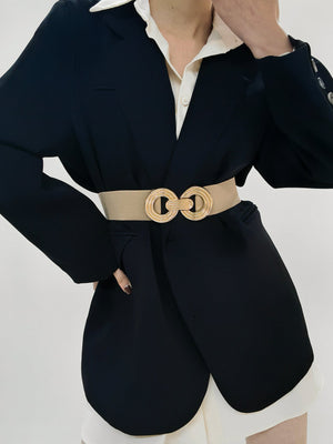 Stretch belt in Caramel with interlocking gold buckle detail.