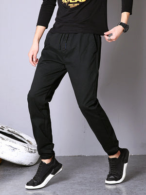 Black casual pants with drawstring waist and cuffed ankles