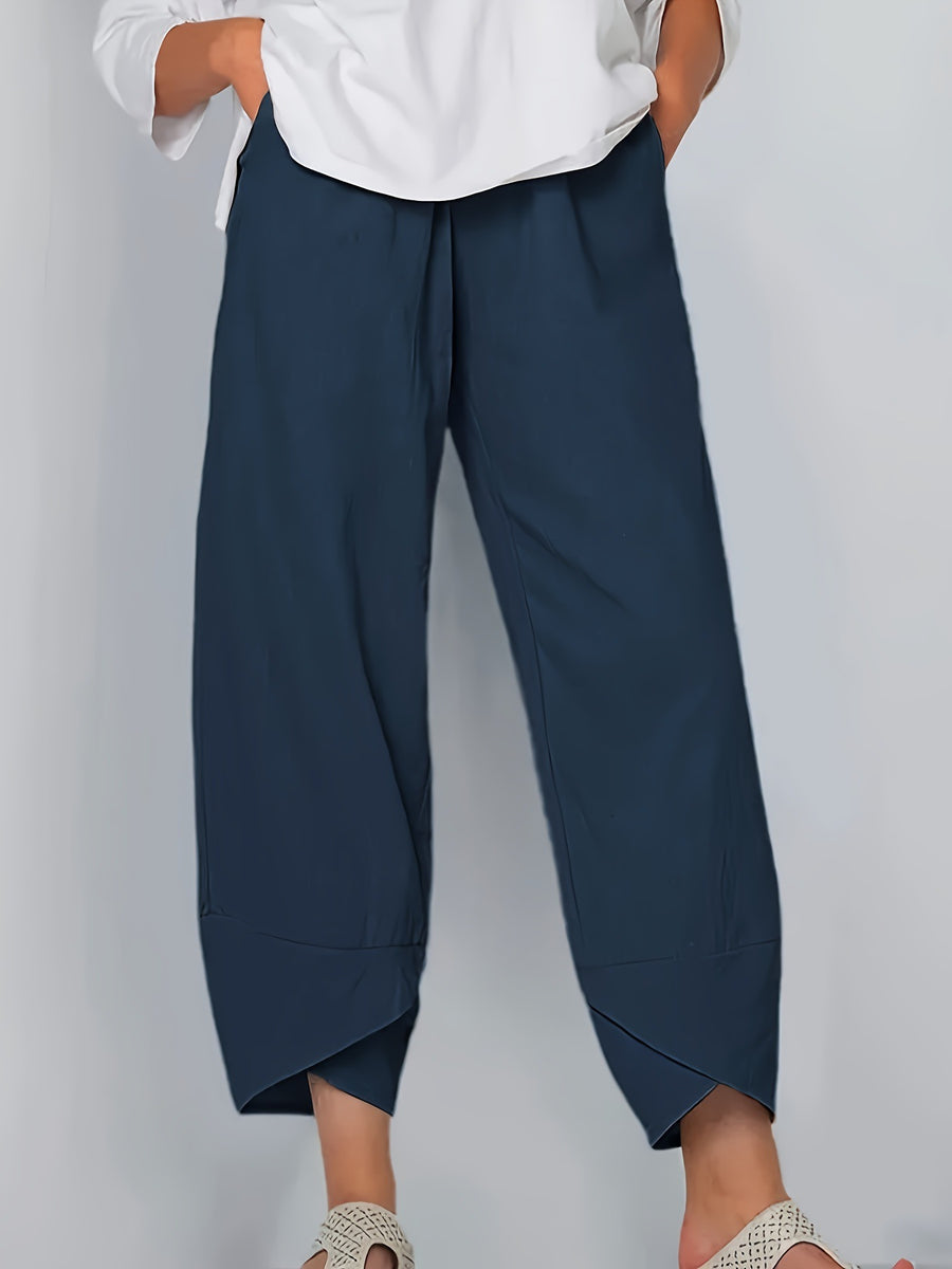 Navy blue relaxed fit wide-leg pants with pockets and asymmetrical hem detail
