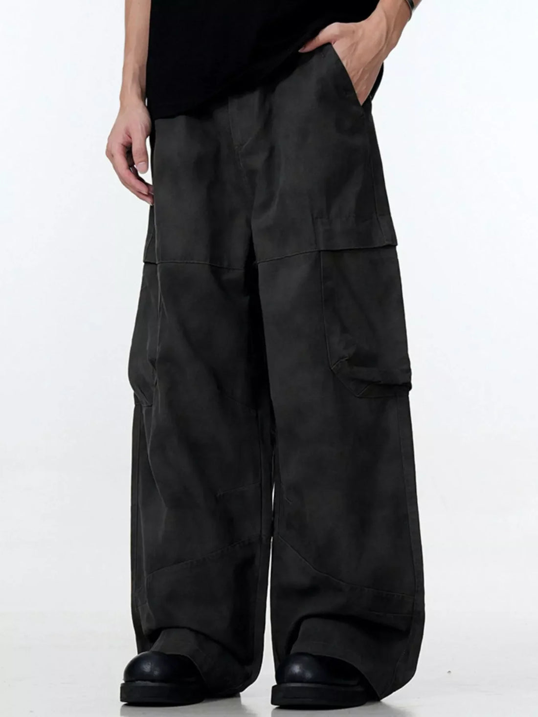 Relaxed fit black cargo pants with multiple pockets and a wide leg.