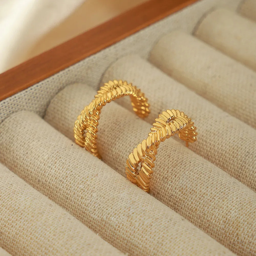 Braided gold vermeil hoop stud earrings with a twisted rope design.