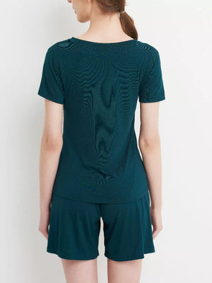 Two-piece pajama set in Fini Green, short sleeve top and shorts.