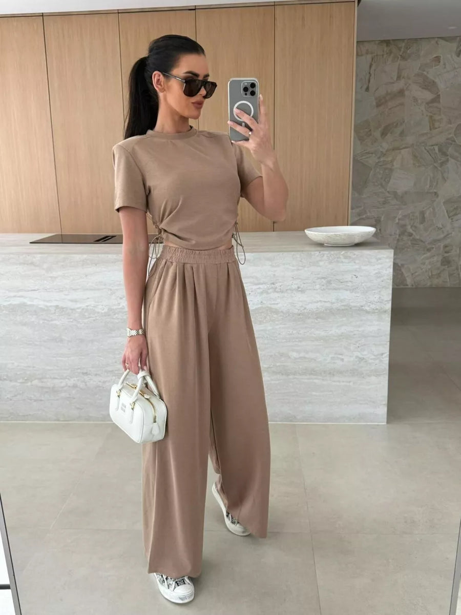 Mocha crop top with drawstring sides and wide-leg pants set.
