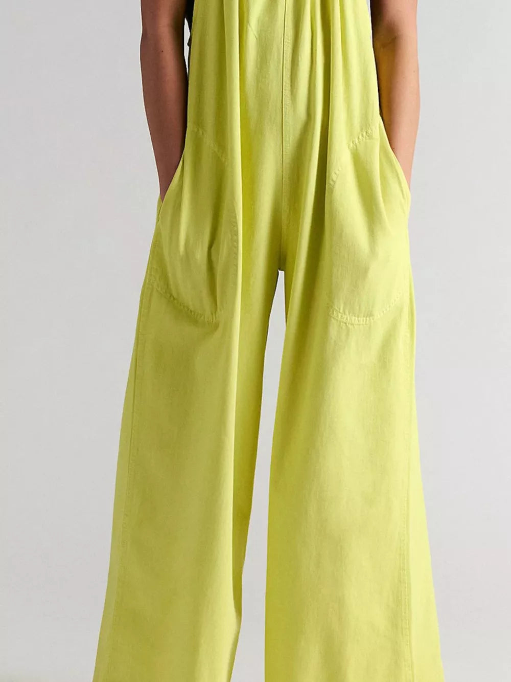 White jumpsuit with gathered neckline and sleeveless