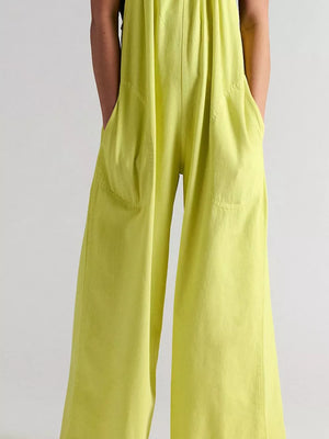 White jumpsuit with gathered neckline and sleeveless