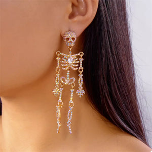clear earrings featuring zircon embellishment and skeleton