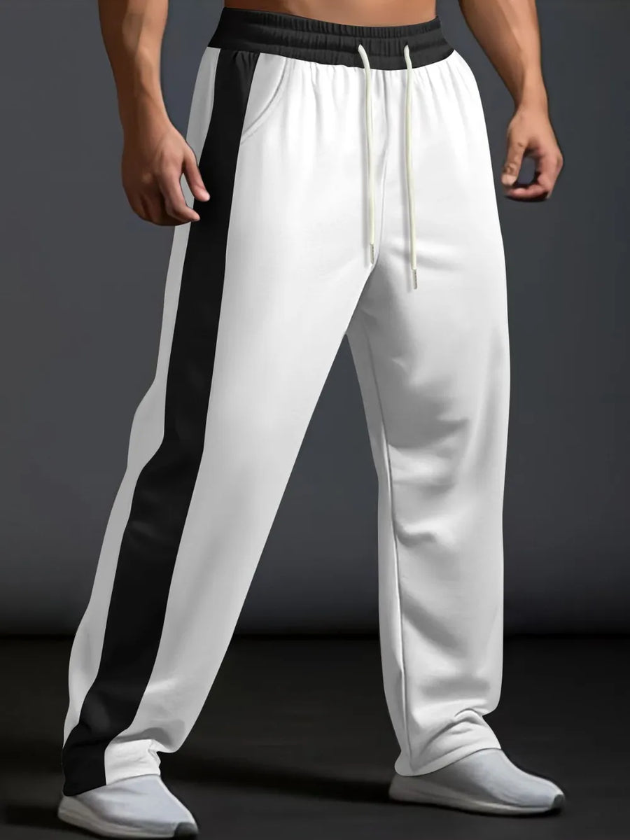 White track pants with black side panel detail and drawstring waist.