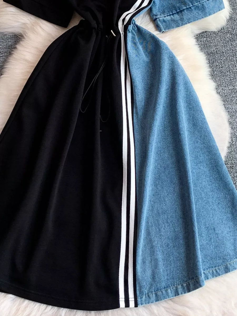 Color block casual dress with drawstring, black and denim panels, and white stripe detail.