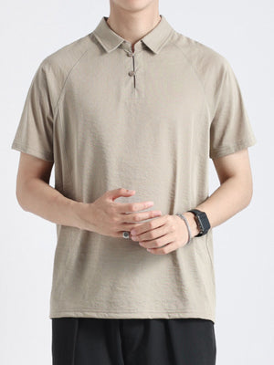 Khaki cotton blend polo shirt with two-button placket and short sleeves.