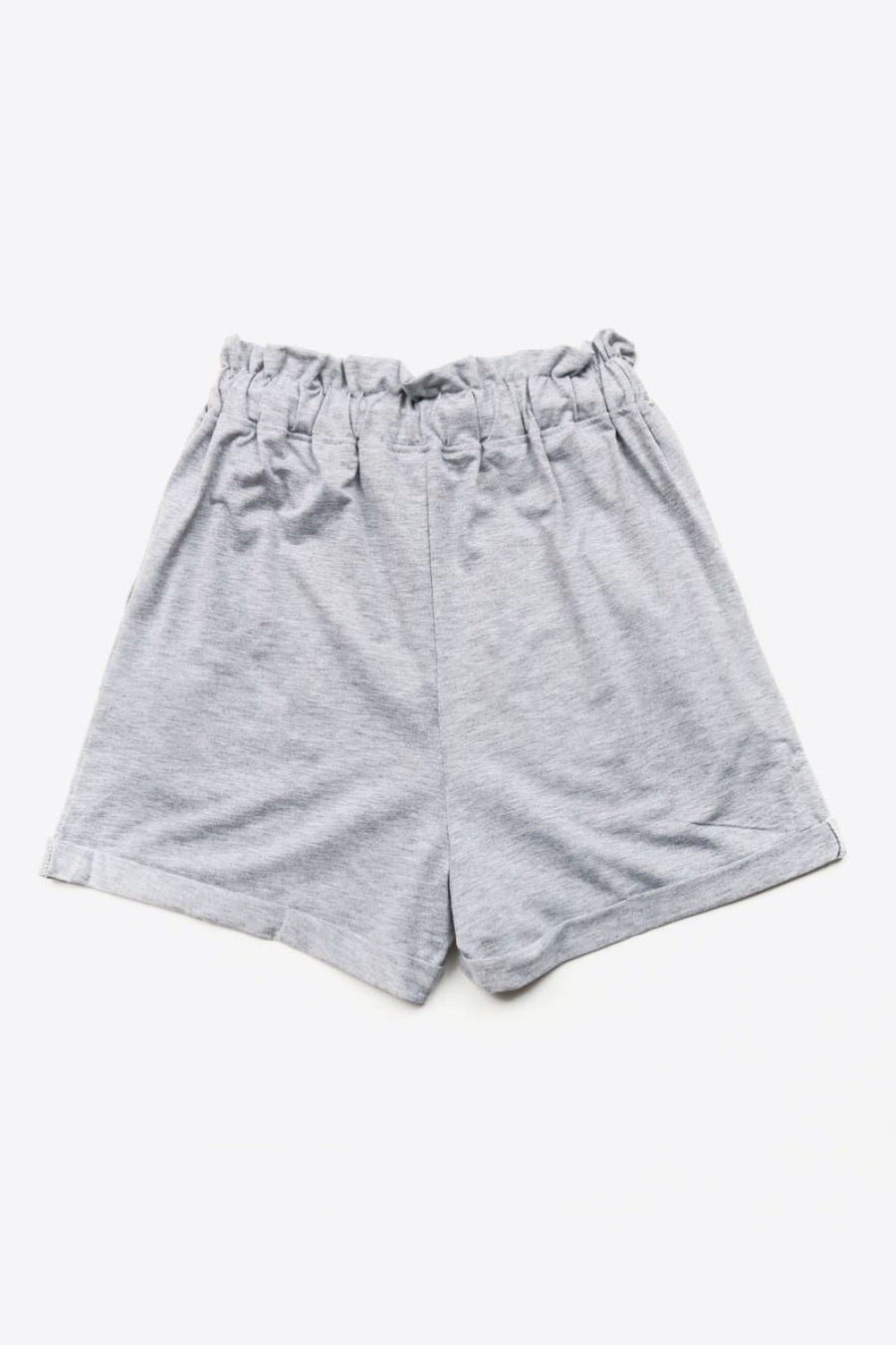 Light gray paperbag waist shorts with decorative buttons and a comfortable fit.