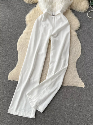 White strapless wide-leg jumpsuit with feather trim and belt detail.