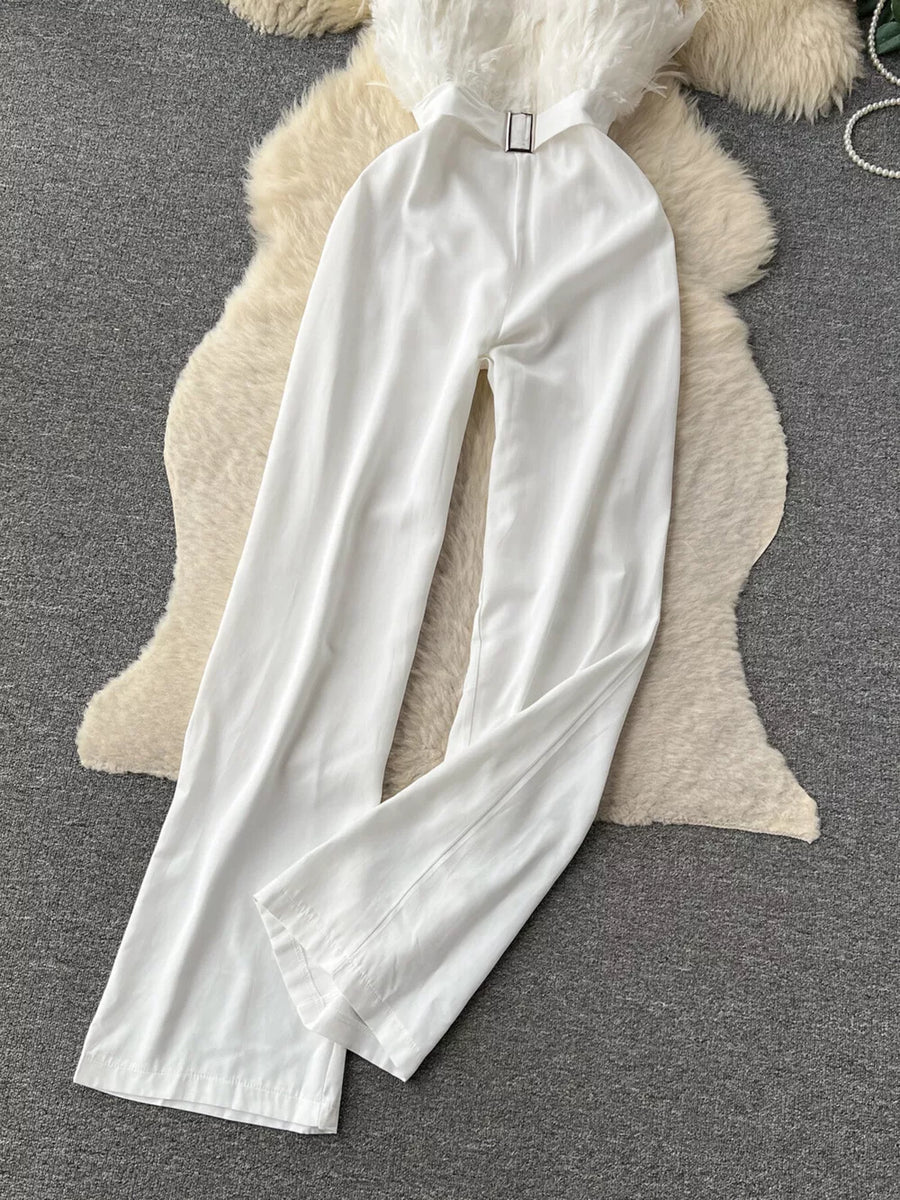 White strapless wide-leg jumpsuit with feather trim and belt detail.