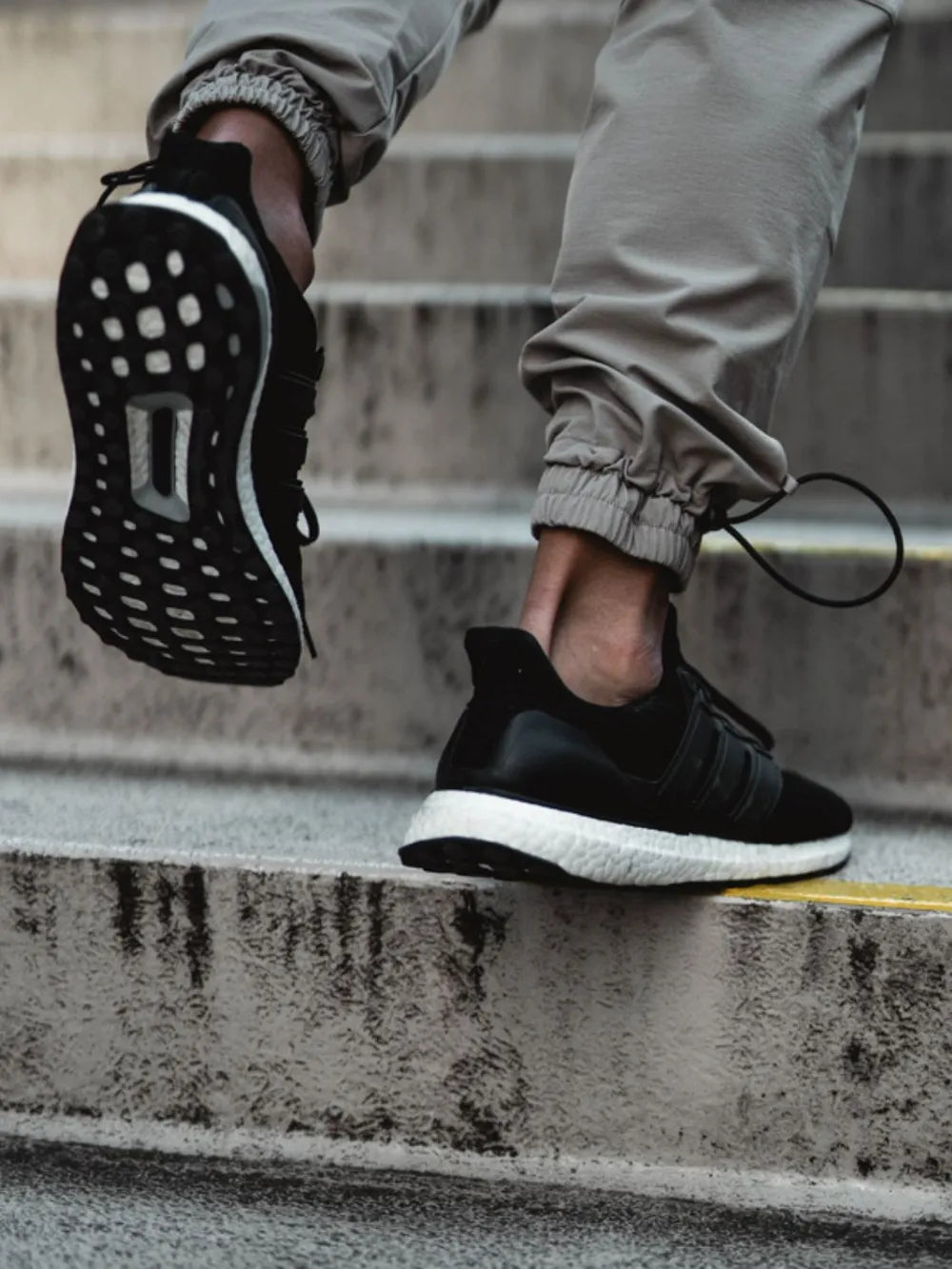 Tech-Utility Cargo Joggers in gray with drawstring ankle detail.