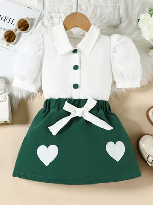 Baby girls green skirt and white puff sleeve top ensemble with heart details and bow