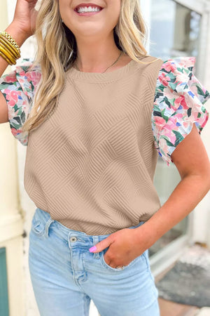 Beige textured shirt with floral ruffle sleeves and a crew neck.
