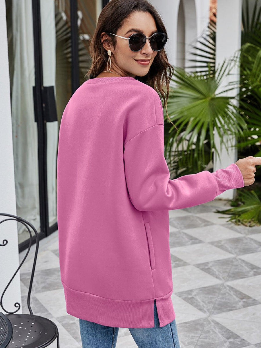 Christmas graphic tunic sweatshirt in Dusty Pink with side pockets and crew neck.