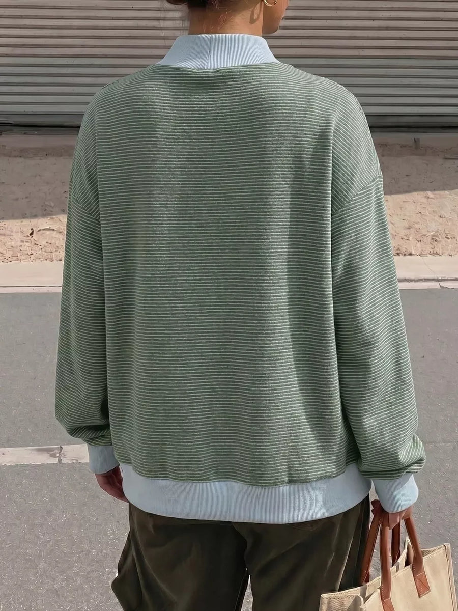 95% polyester, 5% elastane Care instructions: Machine wash cold sweatshirt in Blue with relaxed silhouette