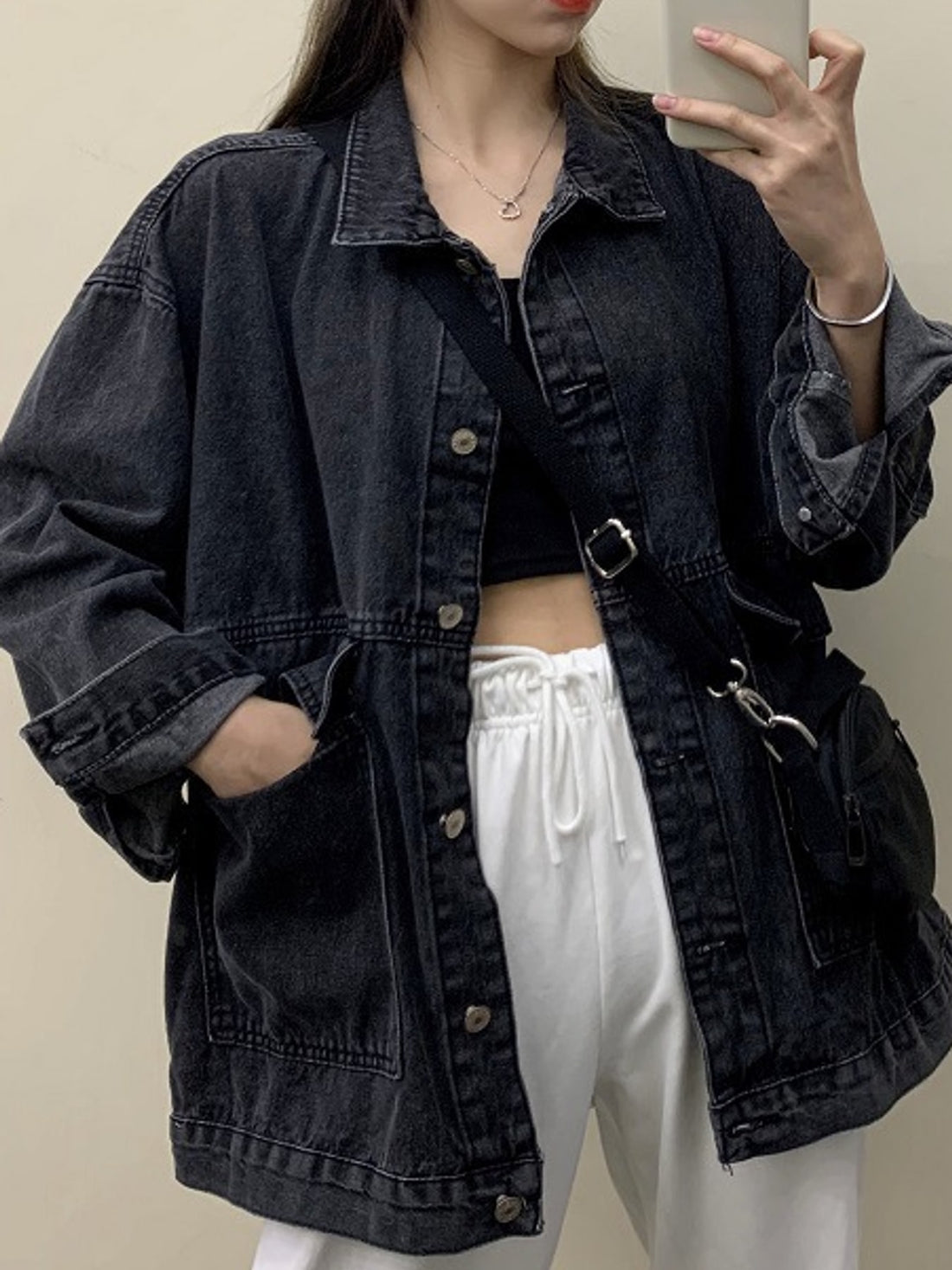 denim jacket in medium wash blue with washed and hip-length