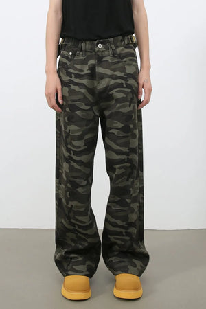 Wide-leg camo denim trousers in black with a relaxed fit.