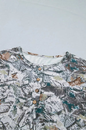 Earthy camouflage print henley t-shirt with buttoned placket and crew neck.
