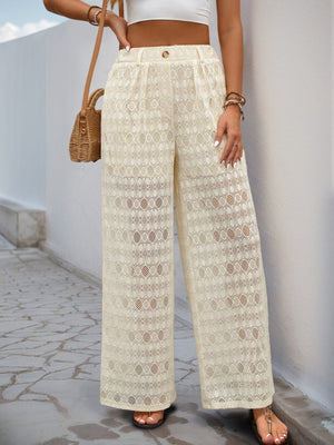 Cream lace palazzo trousers with button detail and wide leg cut.