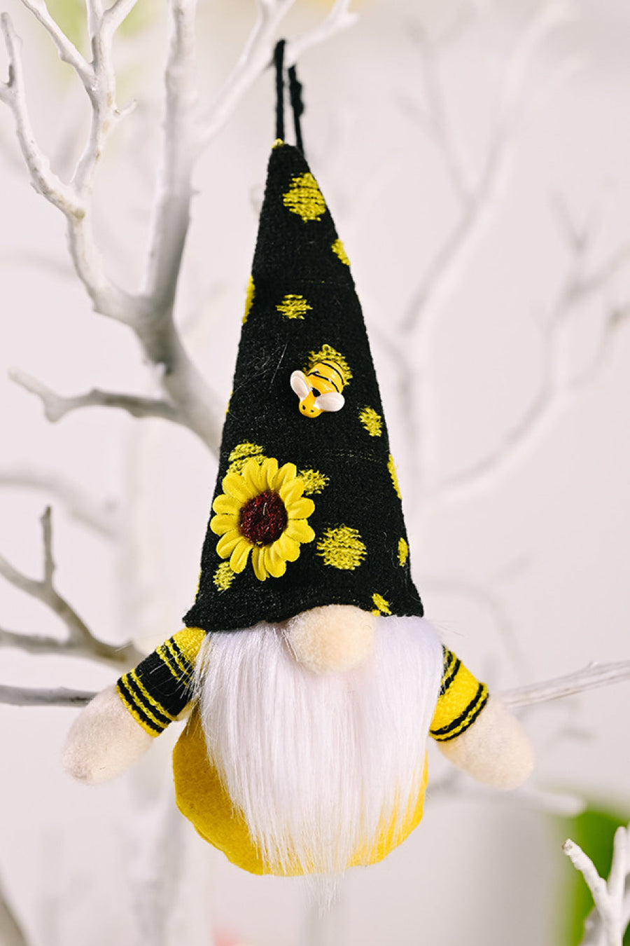 Bee-themed gnome ornament with sunflower and bee details on black hat, yellow body, and white beard.