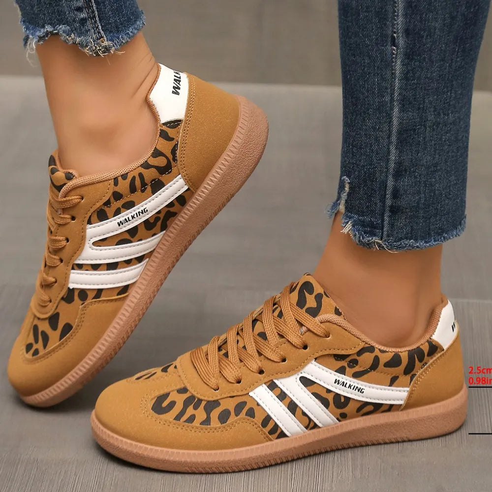 Leopard print walking sneakers with white stripes and brown soles.