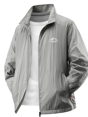 Lightweight windbreaker jacket in light gray with a zip front and embroidered mountain logo.
