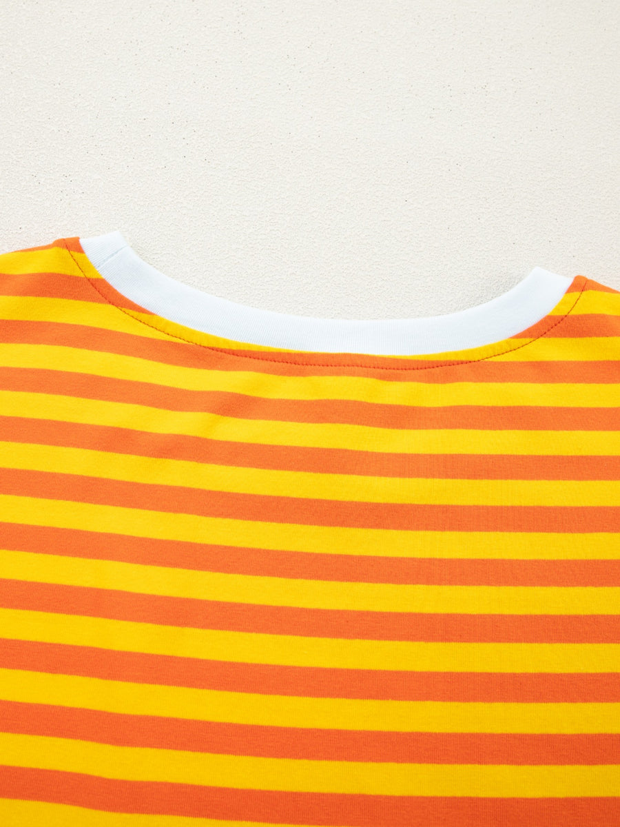 Striped round-neck t-shirt in tangerine and yellow cotton with a white neckline.