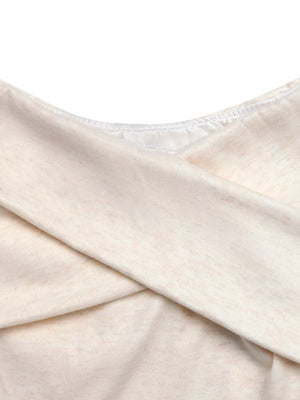 Cream marled knit top with crossover detail and satin trim neckline
