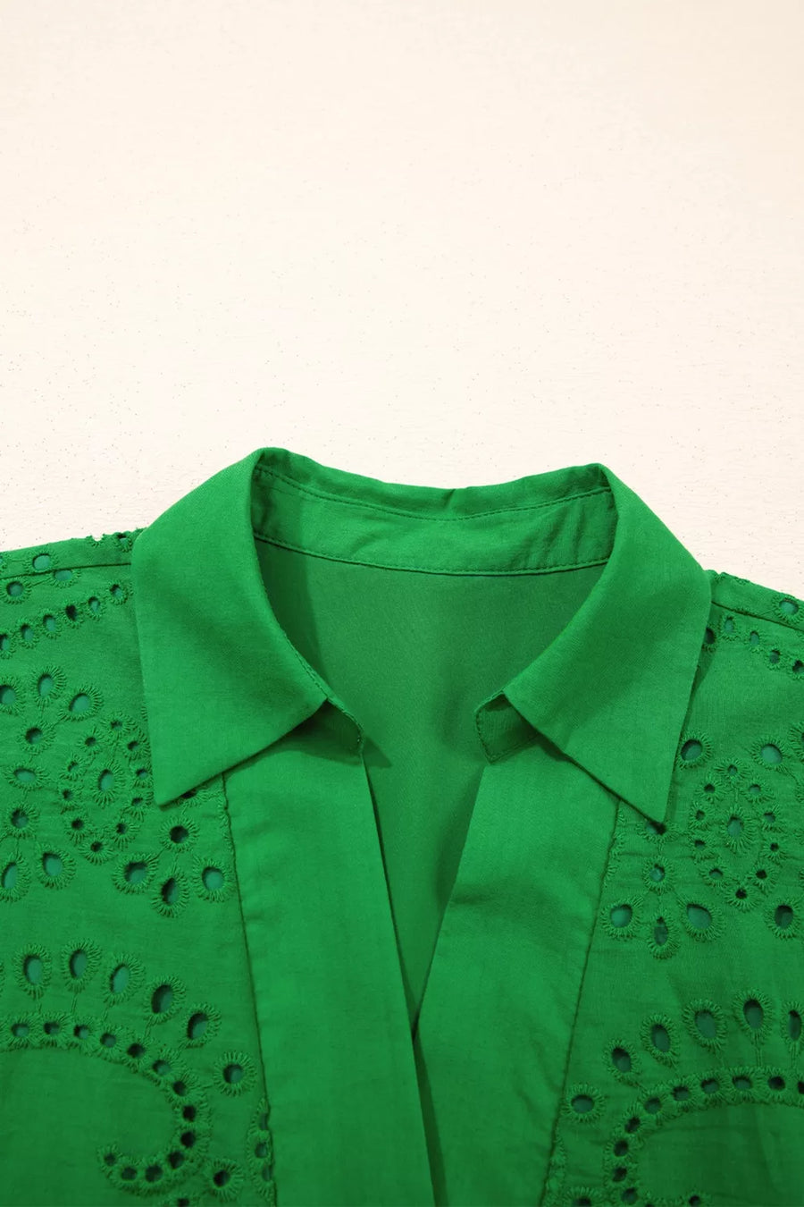 Green cotton collared dress with eyelet detail and scalloped hem.