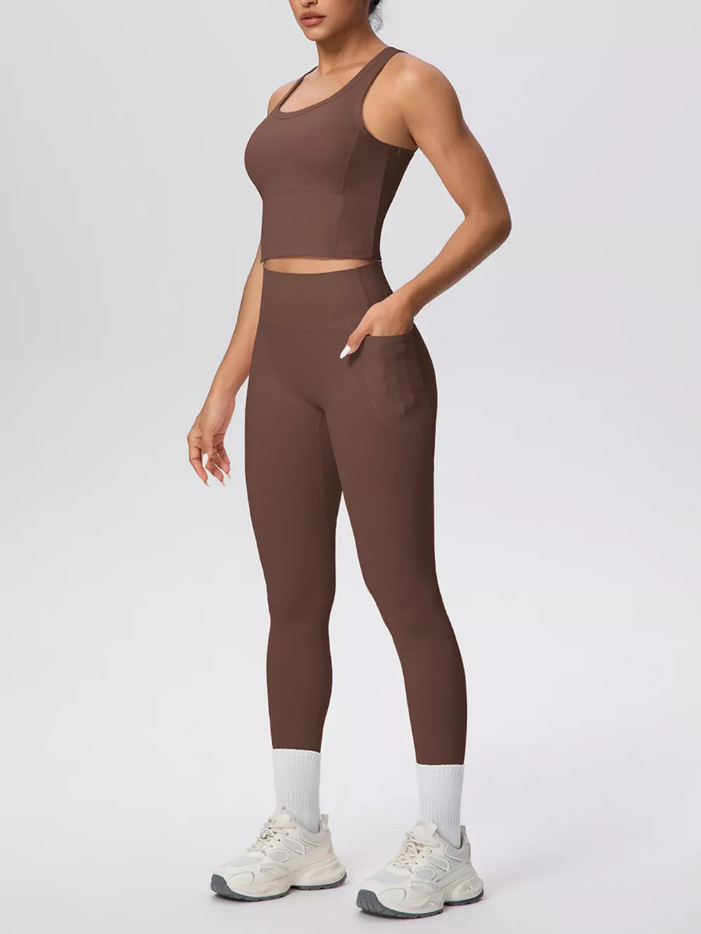 80% nylon, 20% spandex Care instructions: Machine wash cold athletic tank in navy blue with fitted silhouette