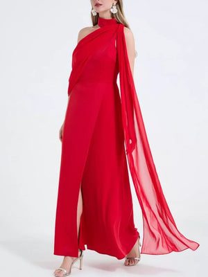 Red asymmetrical maxi dress with high slit and draped chiffon sleeves.