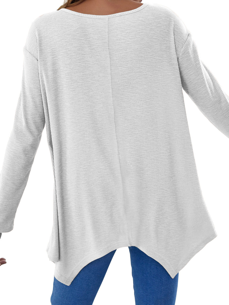 White ribbed knit tunic with long sleeves and an asymmetric hem