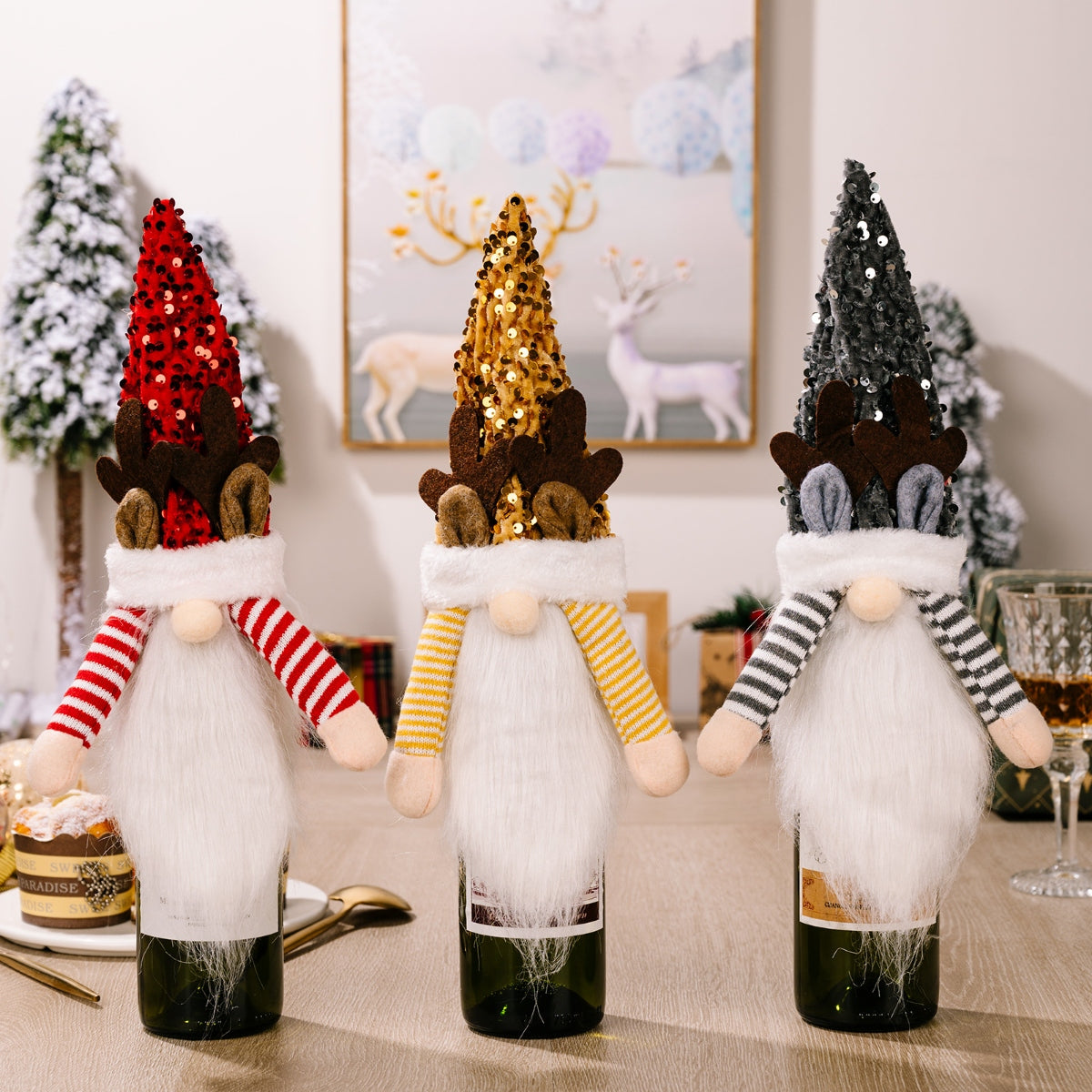 Festive gnome bottle toppers in red, gold, and dark gray with sequin hats and reindeer antlers.