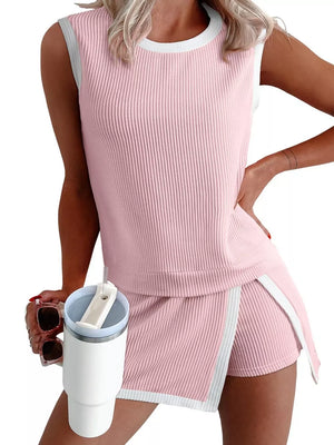 Pink ribbed knit sleeveless top and skort set with white trim.