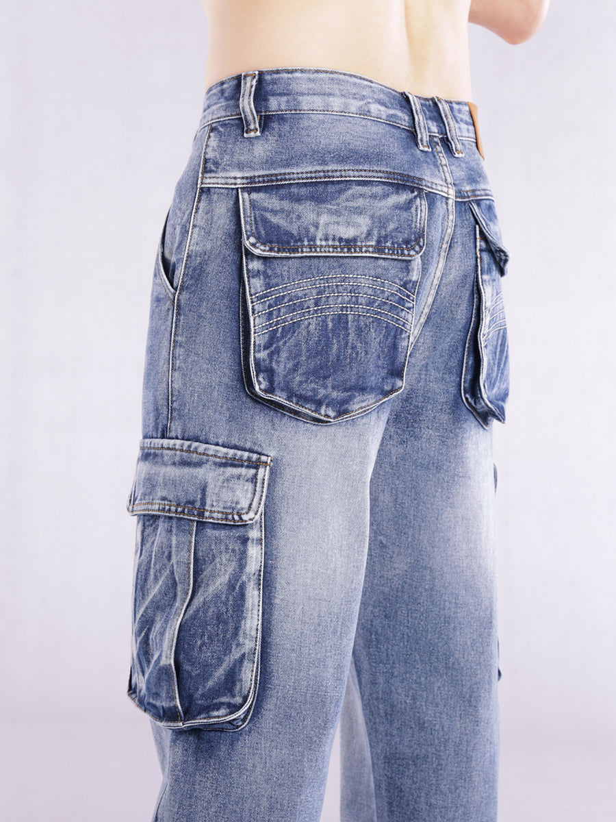 Relaxed fit light wash denim cargo jeans with flap pockets and contrast stitching.