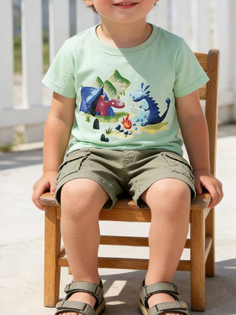 Baby boys light green cotton t-shirt with playful dragon camping graphic