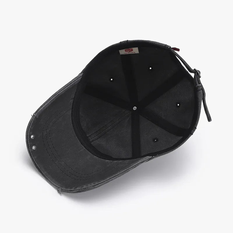 Black cotton baseball cap with distressed details and adjustable strap