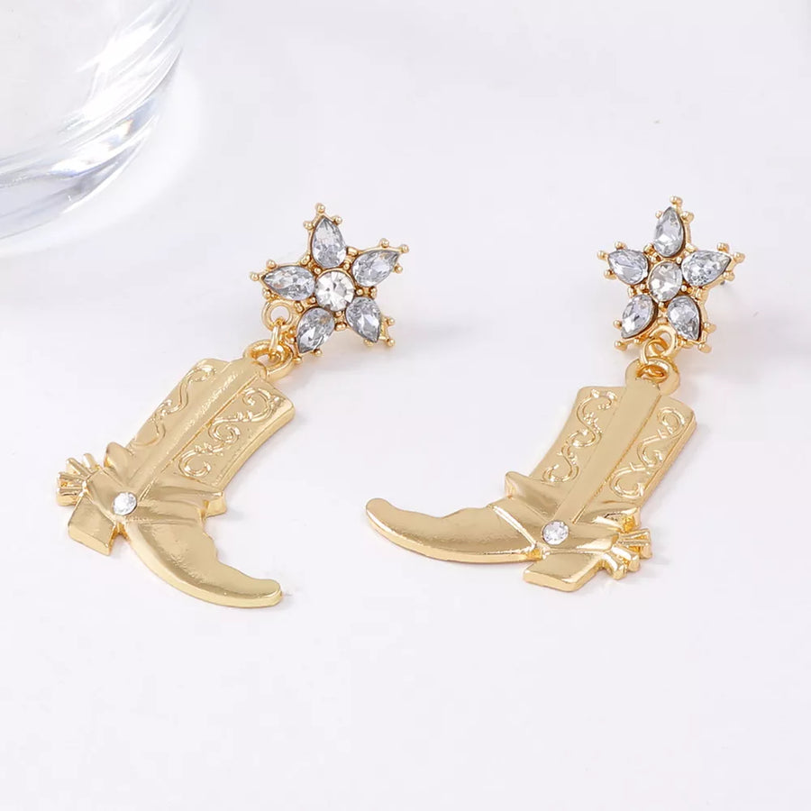 Gold earrings featuring dangle and ornamental