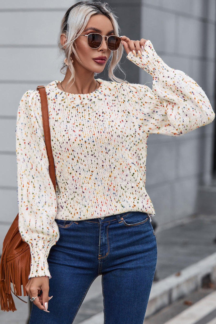 Confetti speckle puff sleeve knit sweater in cream with a round neckline.